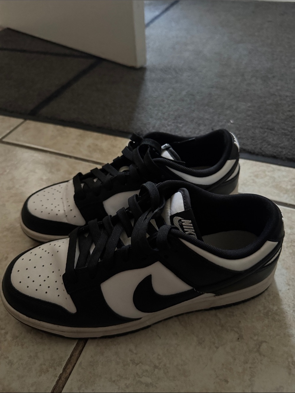 Nike Women’s Black and White Low Top Sneakers with Swoosh
